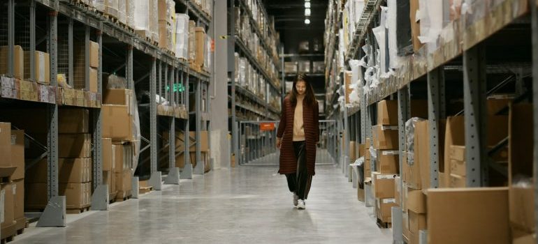 woman walking through warehouse